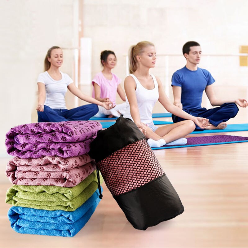 Group meditating with YOUGLE non slip yoga mat towel collection in vibrant colors for stability and comfort during fitness sessions
