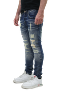 RIPPED MID-RISE SKINNY JEANS